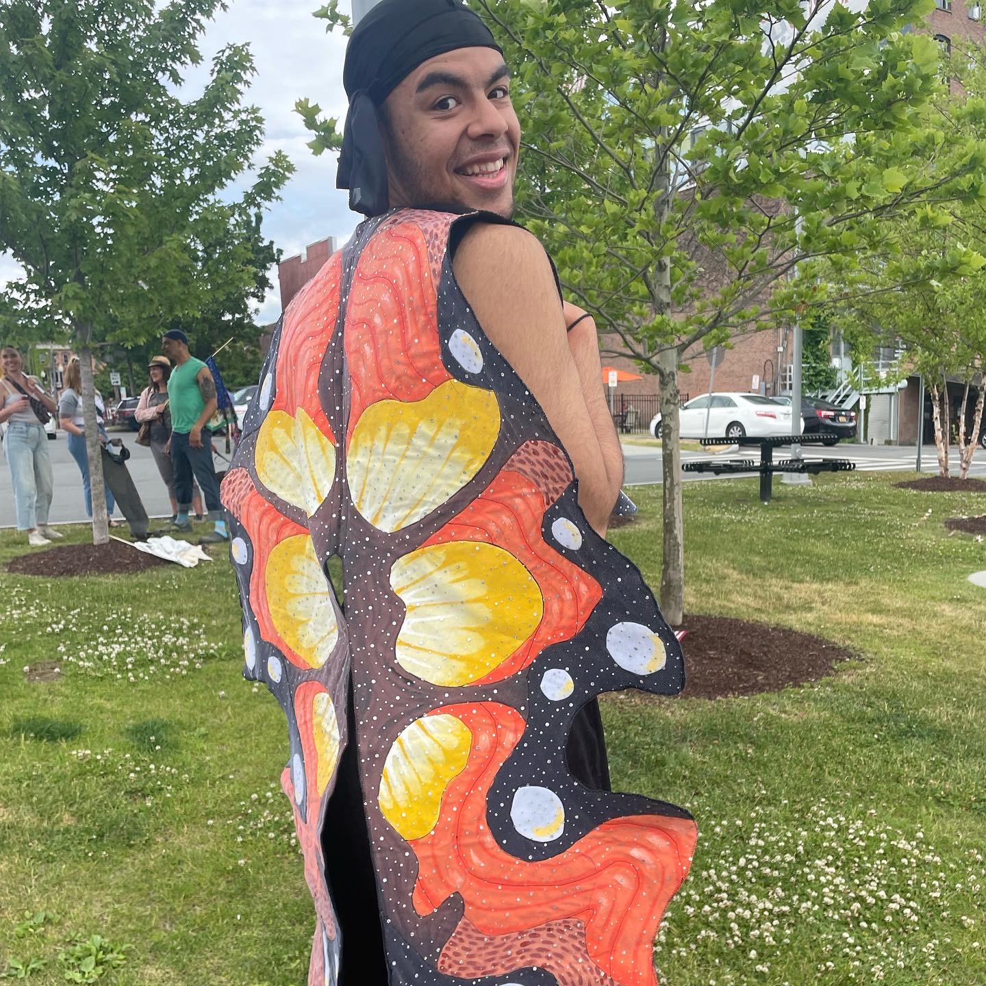 William Carter created a shawl-like wearable flag this is inspired by the wings of a butterfly. He states, "If only we all develop wings as a reward for our collective journeys and metamorphoses...if only we could fl."